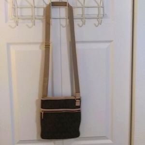 Michael Kors shoulder handbag with MK design in brown. Slightly used.